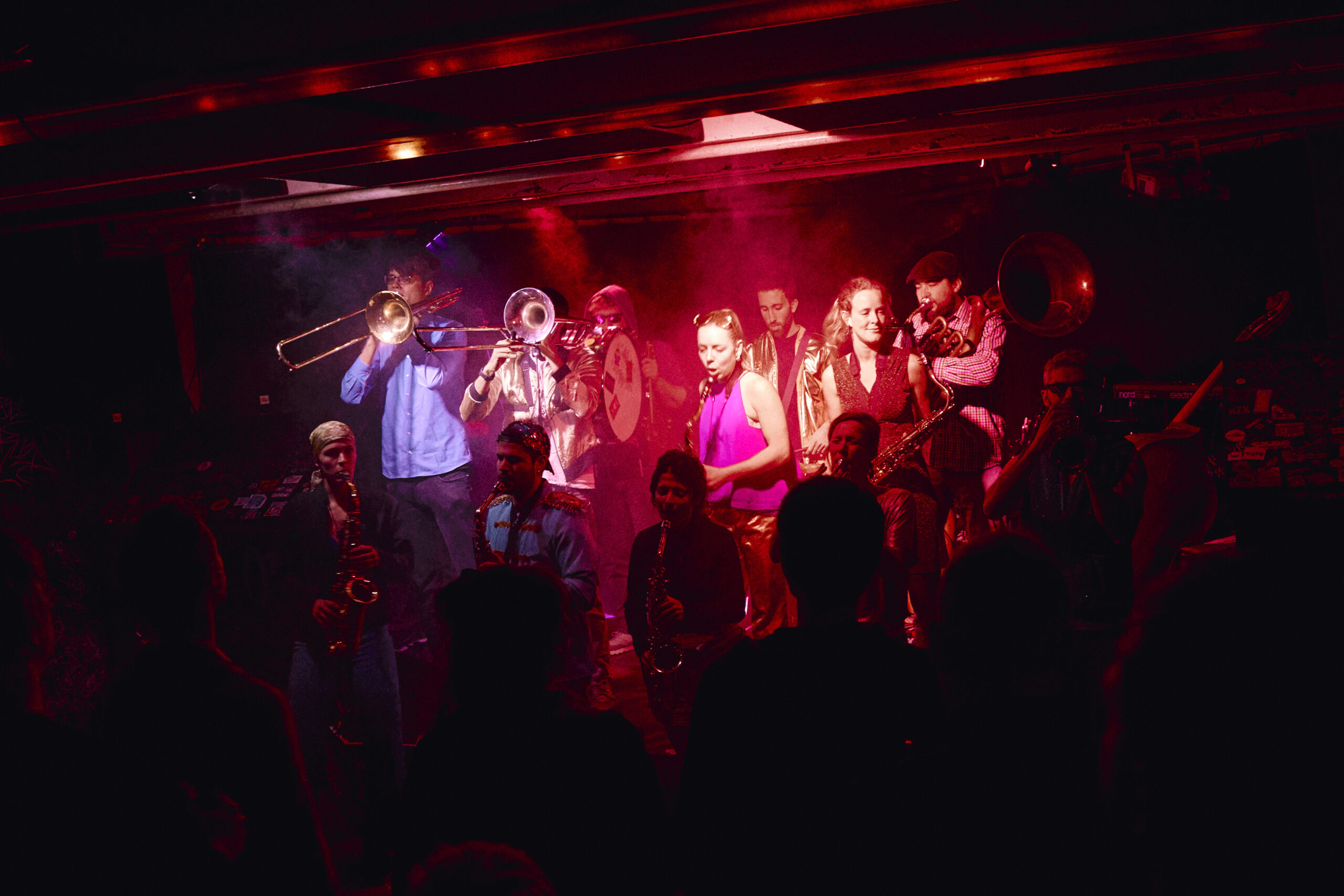 Home Photograph of a brass band playing on a stage